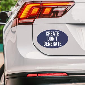 May include: A white car's rear with a navy blue oval sticker. The sticker has the white text "CREATE DON'T GENERATE". The car's tail lights are red and orange.