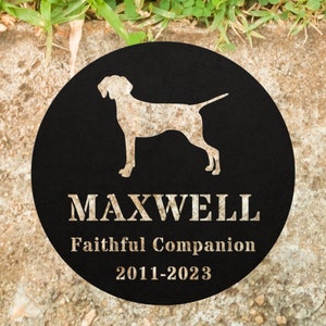 May include: Black metal memorial plaque with a silhouette of a dog and the text "MAXWELL Faithful Companion 2011-2023".