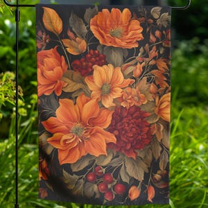 May include: A garden flag with a floral design featuring orange, red, and brown flowers on a black background.