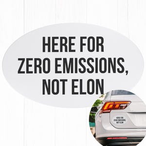 May include: White oval sticker with black text that reads "Here for zero emissions, not Elon". The sticker is on the back of a white car.