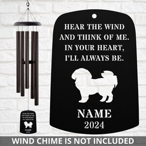 May include: Black metal wind chime memorial plaque with a white silhouette of a dog and the text "Hear the wind and think of me. In your heart, I'll always be. NAME 2024".