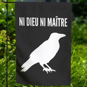 May include: Black garden flag with a white silhouette of a crow and the text "NI DIEU NI MAÎTRE" in white.
