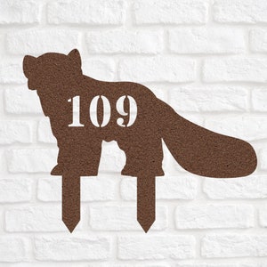 May include: Brown metal garden stake shaped like an animal with the number 109 printed on it. The stake is designed to be placed in the ground.