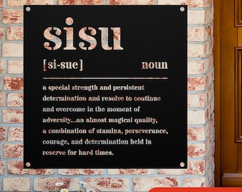 May include: A black metal sign with the word "sisu" in white letters. The definition of the word is written below in white letters: "[si-sue] noun a special strength and persistent determination and resolve to continue and overcome in the moment of adversity...an almost magical quality, a combination of stamina, perseverance, courage, and determination held in reserve for hard times."