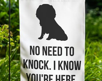May include: White garden flag with a black silhouette of a dog sitting. The text on the flag reads "No need to knock. I know you're here."