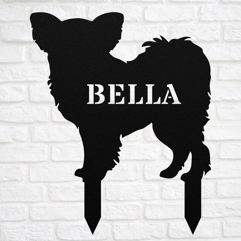 May include: Black metal silhouette of a Chihuahua dog with the name "BELLA" on the body. The silhouette is on two metal stakes for inserting into the ground.