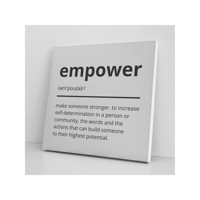 May include: Black and white typography print with the word "empower" and its definition: "make someone stronger. to increase self-determination in a person or community. the words and the actions that can build someone to their highest potential."