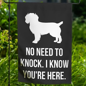 May include: Black and white garden flag with a silhouette of a dog and the text "NO NEED TO KNOCK. I KNOW YOU'RE HERE."