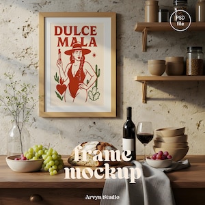 May include: A framed art print with the words "DULCE MALA". The artwork features a woman in a red swimsuit and hat, holding a match. The print is in a light wood frame. The background is neutral.