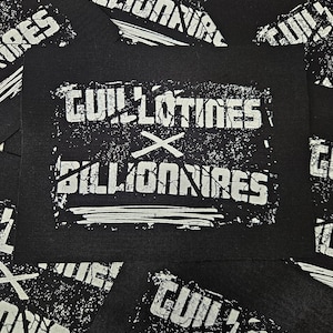 May include: Black and white patch with the text "Guillotines x Billionaires" in a distressed font.