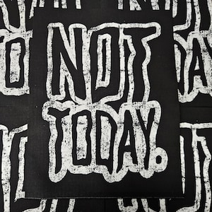 May include: Black and white patch with the text "NOT TODAY!" in a bold, distressed font.