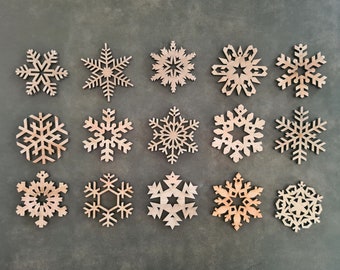 15 wooden snowflakes laser cut. Original Christmas decoration, to put on a table or to hang. Winter atmosphere.