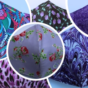 May include: A collage of six different fabric face masks. The masks are all purple and feature various patterns, including floral, paisley, and abstract designs.