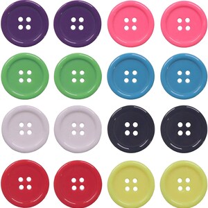 May include: A set of 12 colorful plastic buttons with four holes each. The buttons are in various colors, including purple, pink, green, blue, white, red, and yellow.