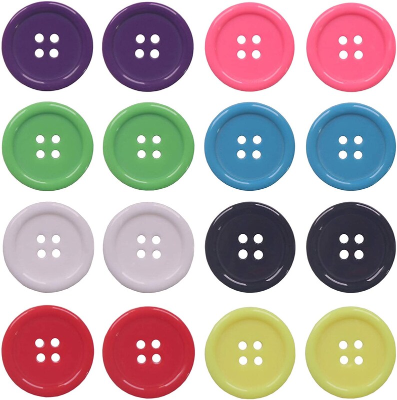 May include: A set of 12 colorful plastic buttons with four holes each. The buttons are in various colors, including purple, pink, green, blue, white, red, and yellow.