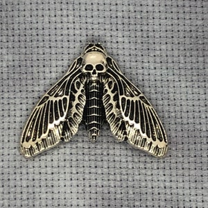 Death’s head moth needle minder