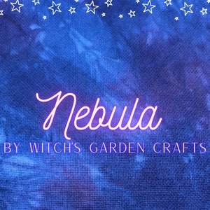 May include: A blue and purple tie-dye background with white stars at the top. The text "Nebula" is written in white with a pink outline. Below the text is the phrase "By Witch's Garden Crafts".