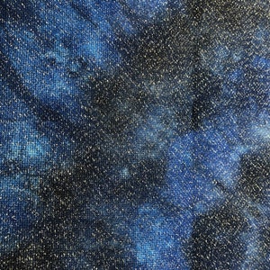 May include: A close-up of a blue and black fabric with a glittery texture. The fabric has a tie-dye pattern with swirls of blue and black.