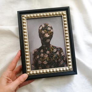 Faceless female portrait painting In Wooden frame