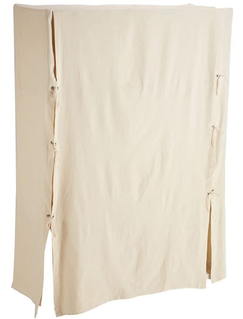 May include: A white cotton garment cover with ties and a zipper closure. The cover is designed to protect furniture or other items from dust and dirt.