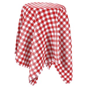 May include: Red and white checkered tablecloth draped over a table. The tablecloth is made of a soft, woven fabric and has a classic gingham pattern.