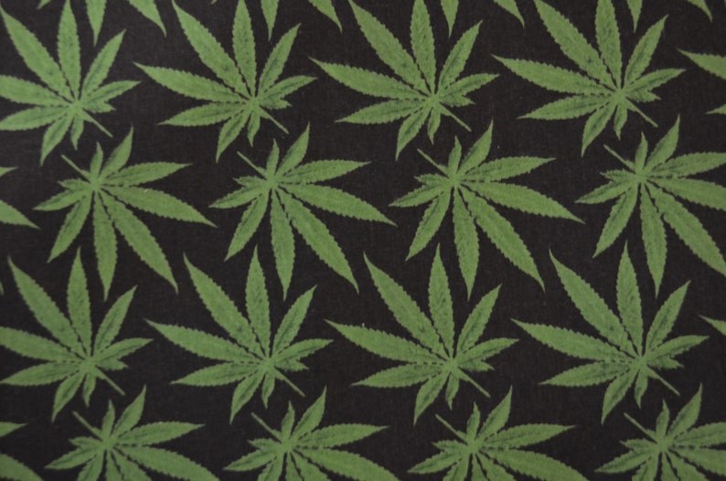 May include: A black background with a repeating pattern of green cannabis leaves.