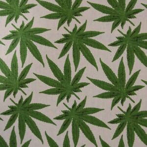 May include: A seamless pattern of green marijuana leaves on a white background.