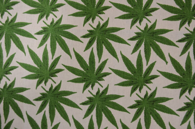 May include: A seamless pattern of green marijuana leaves on a white background.