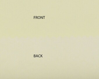 May include: A close-up of a light beige surface with the words "FRONT" and "BACK" printed in black.