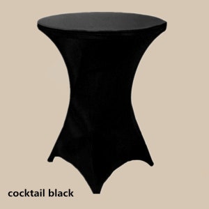 May include: Black cocktail table cover. The cover is made of a stretchy fabric and fits snugly over the table. It has a simple, elegant design.