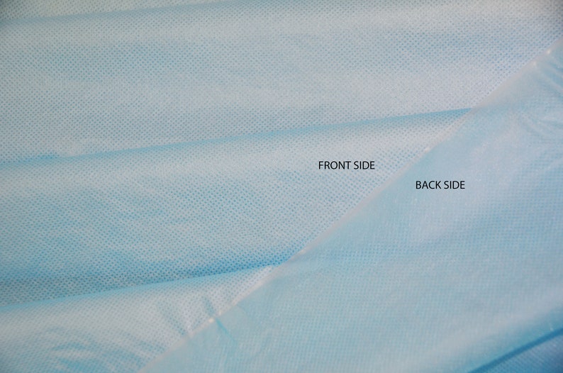 May include: Close-up of a light blue fabric with a fine, textured pattern. The fabric is folded in half, with the words "Front Side" and "Back Side" labeled on the two sides.