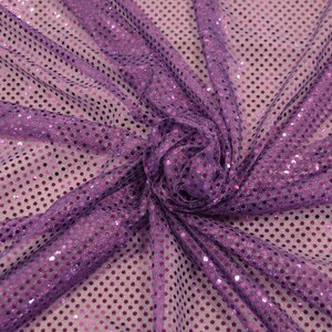 May include: Purple mesh fabric with small pink sequins in a polka dot pattern.