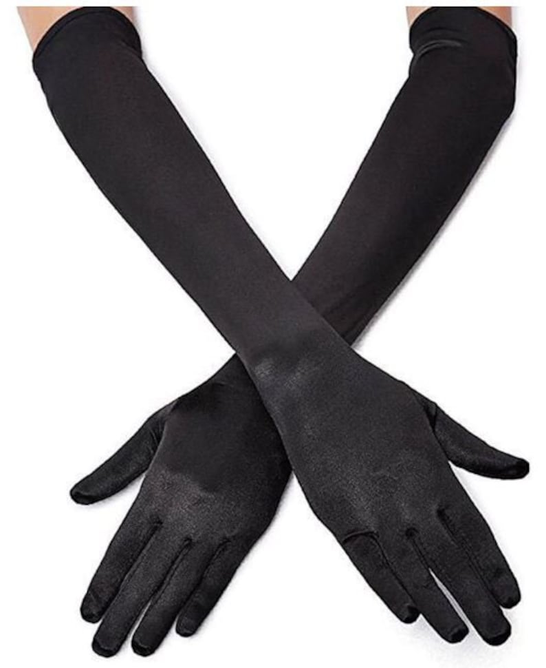 May include: A pair of long black satin gloves. The gloves are fully extended and the fingertips are visible.
