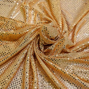 May include: Gold fabric with a subtle shimmer and a pattern of small, evenly spaced circles.