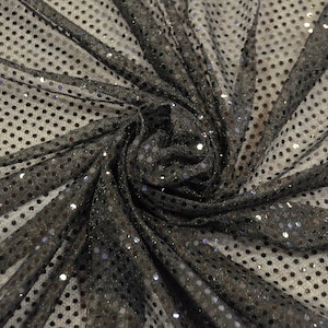 May include: Black mesh fabric with silver sequins in a polka dot pattern.