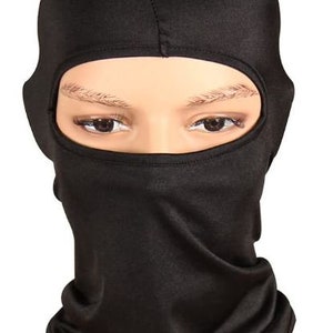 May include: A black balaclava with eye holes. The balaclava is made of a soft, stretchy fabric.