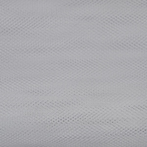 May include: White tulle fabric with a fine, even weave. The fabric is soft and delicate, with a slightly sheer appearance.