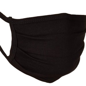 May include: A black face mask made of soft fabric with pleats. The mask has elastic ear loops.