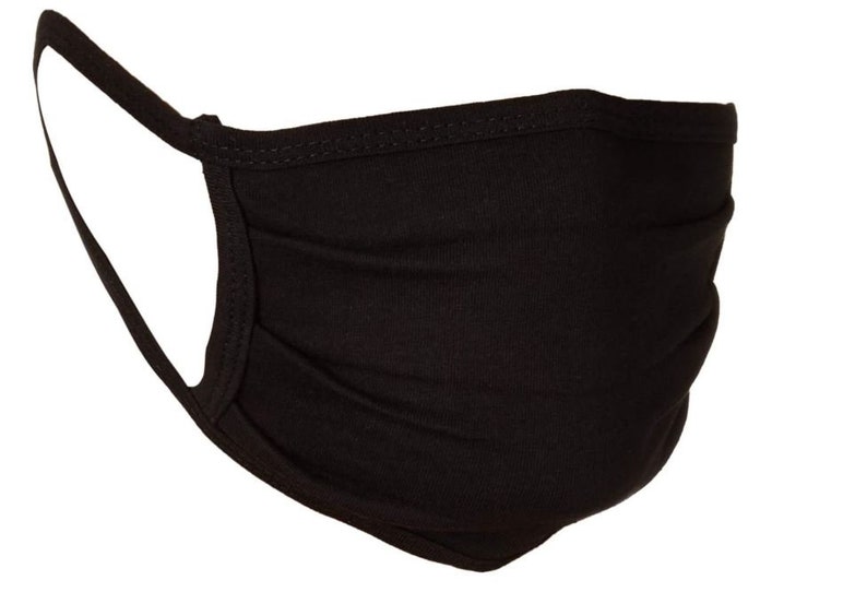 May include: A black face mask made of soft fabric with pleats. The mask has elastic ear loops.