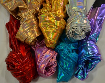 May include: Assortment of iridescent fabric swatches in various colors, including gold, silver, red, purple, teal, and blue.