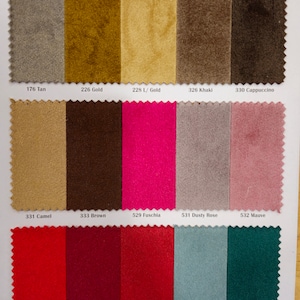 May include: Swatch card displaying 15 fabric samples in a range of colours, including tan, gold, khaki, cappuccino, camel, brown, fuchsia, dusty rose, mauve, red, burgundy, cherry, sea foam, and hunter green. The fabric samples are arranged in rows of five.