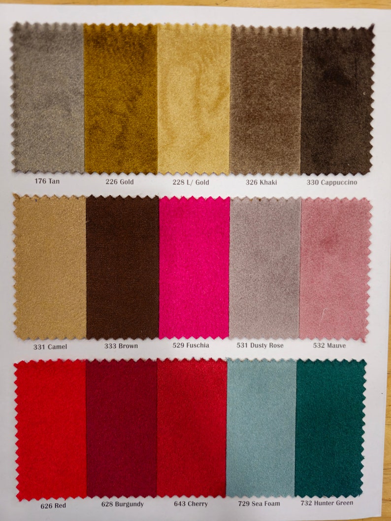 May include: Swatch card displaying 15 fabric samples in a range of colours, including tan, gold, khaki, cappuccino, camel, brown, fuchsia, dusty rose, mauve, red, burgundy, cherry, sea foam, and hunter green. The fabric samples are arranged in rows of five.