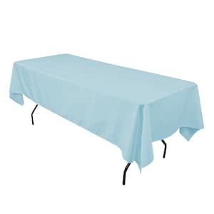 May include: A light blue rectangular tablecloth draped over a table with black metal legs.