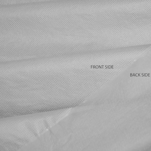 May include: A close-up of a white fabric with a textured surface. The fabric is folded in half, showing the front and back sides. The text "FRONT SIDE" and "BACK SIDE" is printed on the fabric.