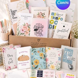 May include: A collection of spiral-bound journals, notebooks, and sticker sheets in a cardboard box. The items feature floral patterns, inspirational text in Spanish, and illustrations including a capybara and a lightbulb.