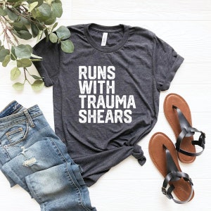 Runs with trauma shears paramedic unisex shirt funny emt gift idea ambulance emergency medical technician ems rescue nicu nurse