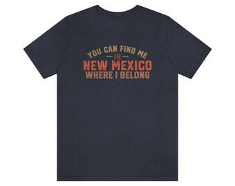 May include: A dark heather grey t-shirt with the text "You can find me in New Mexico where I belong" in a vintage style font.