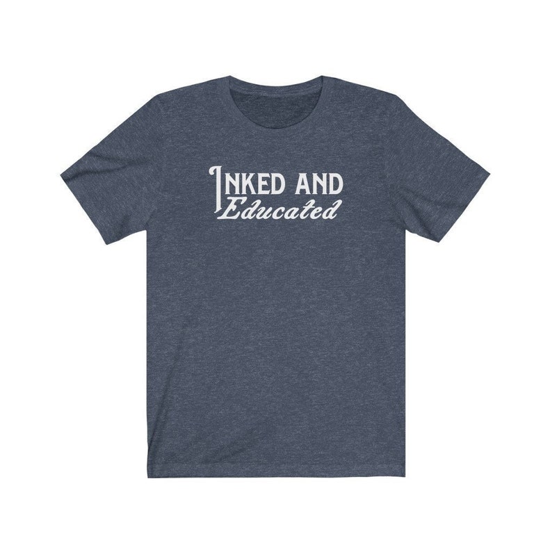 May include: A dark blue t-shirt with the text "INKED AND Educated" in white.