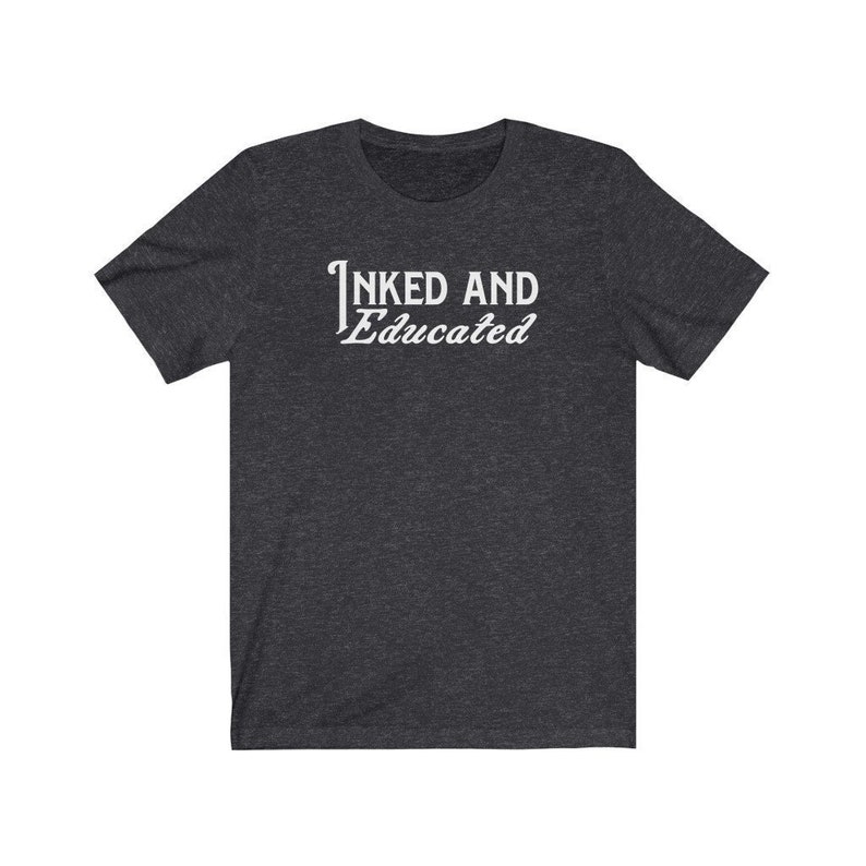 May include: A dark heather grey t-shirt with the text "INKED AND Educated" printed in white.