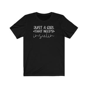 May include: Black t-shirt with white text that reads "Just a girl that needs insulin".